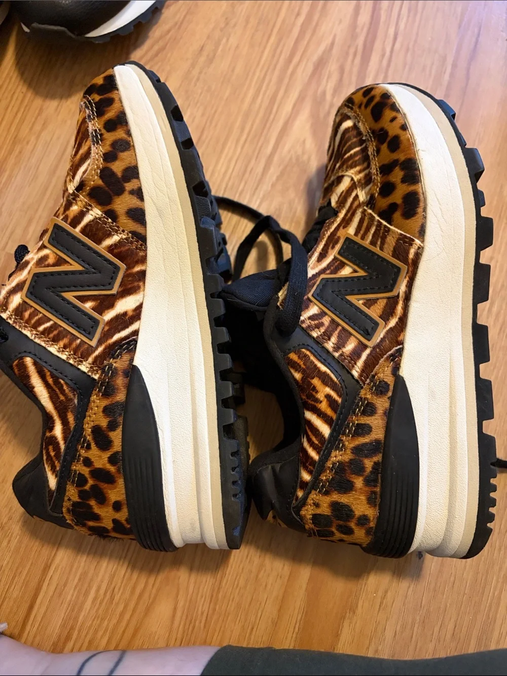 New Balance women’s Leopard-Print Sneakers in Brown and Black